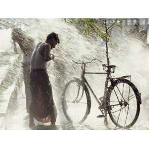  Two Men Are Hosed Down for Purification at the Water 