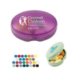   oval pill box fits in pockets or purses.