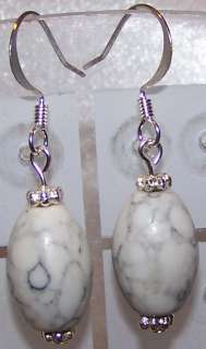 This is a nice pair of 6mm peach colored glass pearl earrings.
