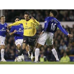 Evertons Lescott challenges Arsenals Aliadiere for the ball during 