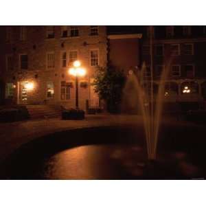 City Sidewalk at Night, Cobblestone Streets and a Splashing Fountain 