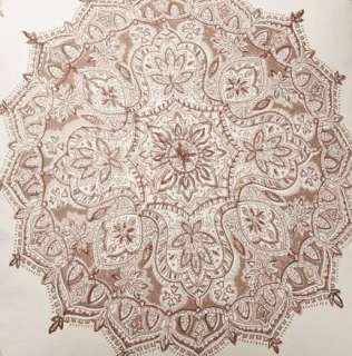   textural cotton, it features a kaleidoscopic floral medallion that