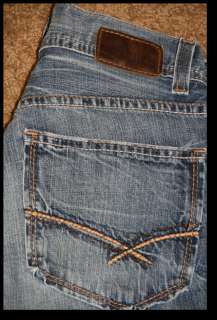 BUCKLE BKE JUDSON DESTROYED BOOT CUT JEANS  