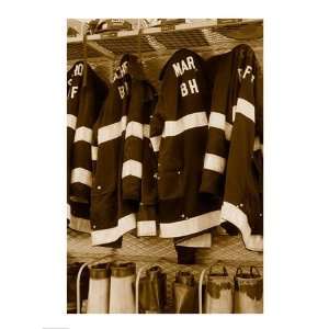  Fire protection suits hanging in a fire station Poster (18 