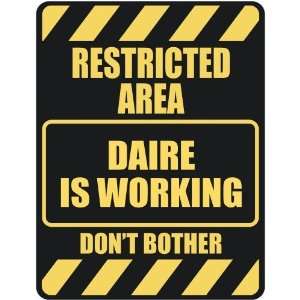   RESTRICTED AREA DAIRE IS WORKING  PARKING SIGN