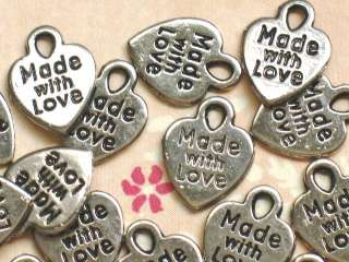 Word Made with Love is printed on both sides of charm