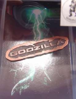 GODZILLA  SET OF 12 BADGES FROM THE 1998 MOVIE (DJ)  