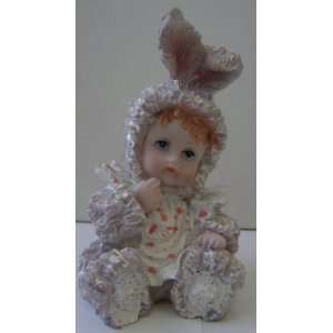 Ceramic Poly Baby in Bunny Rabbit Costume Figurine   3 1/2 inches tall 
