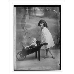  Daughter of Mrs. Marshall Field, pushing doll cart