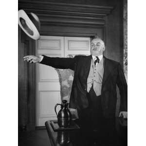  Sydney Greenstreet Throwing Hat in Scene from The 