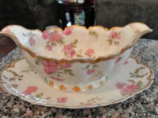 The beautiful gravy boat has outstanding colors of pinks, blues, grays 
