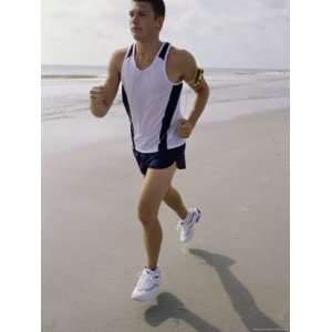  Young Man Jogging on the Beach Giclee Poster Print