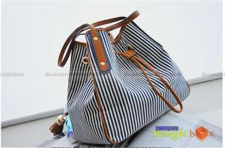 bucket cross body bag with deep blue stripe and high quality tassel.